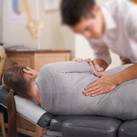 Woman Receiving Chiropractic Adjustment